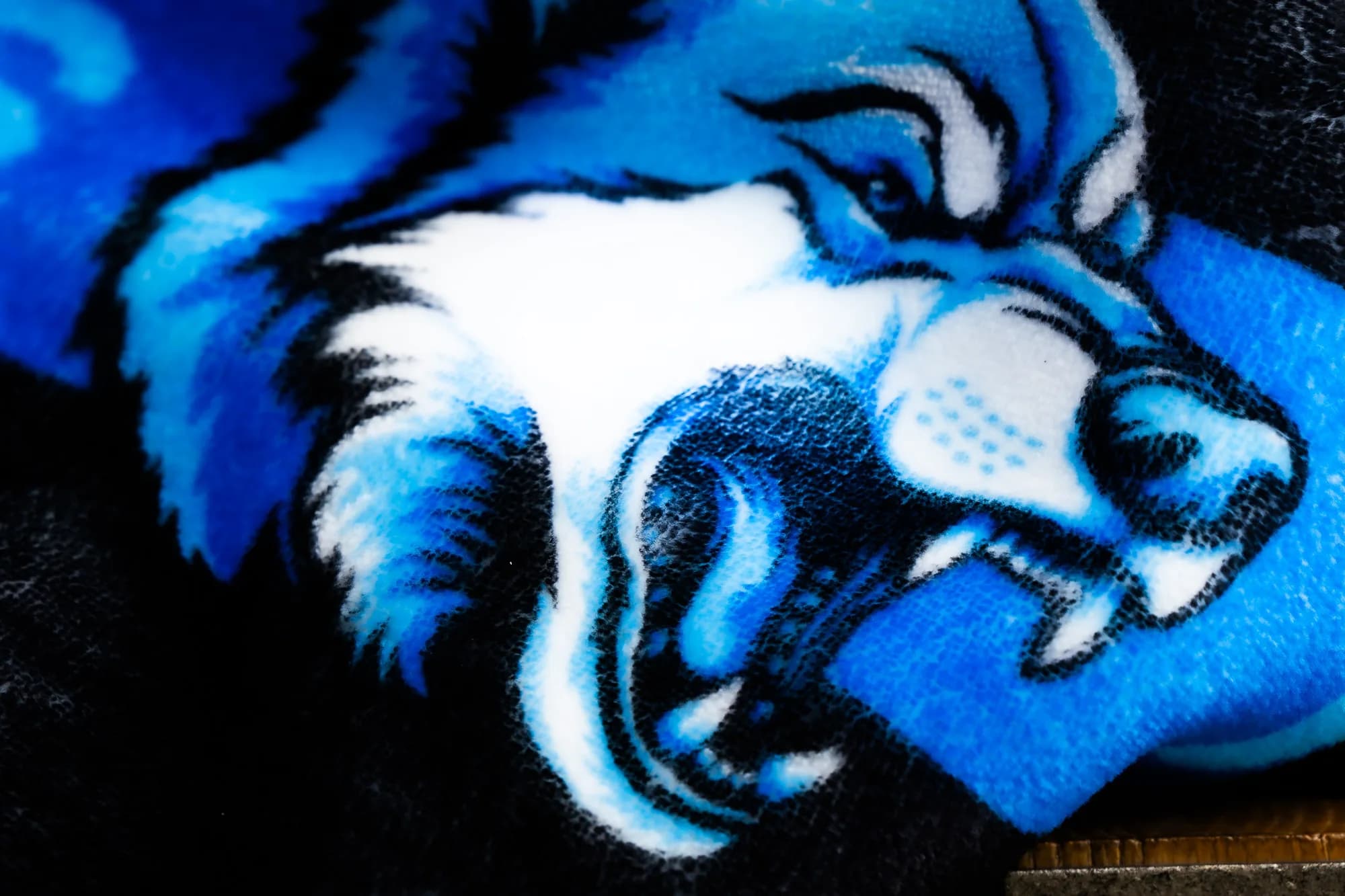 Macro close-up of an edge-to-edge printed wildcat design on plush NubaySoft fabric